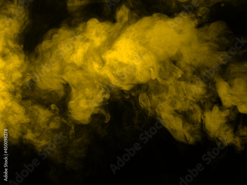 Yellow smoke on black background