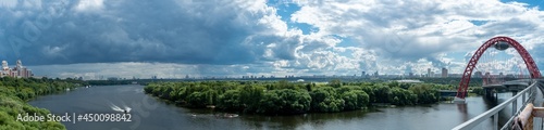 Wide panoramic view of the bend of Moskva River at the Zhivopisny bridge and urban cityscape of the Krylatskoe district, Moscow photo