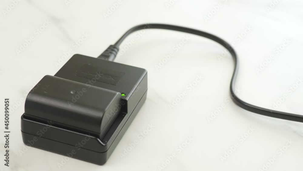 Rechargeable lithium battery for a digital camera with charger Rechargeable lithium battery for a digital camera with charger
