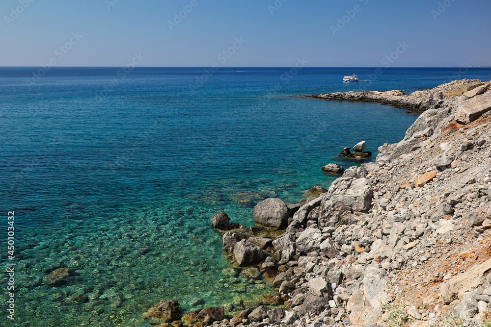 Turquoise Aegean Sea with Rocky Shore during Beautiful Day in Greece. Summer Landscape with Water in Rhodes.