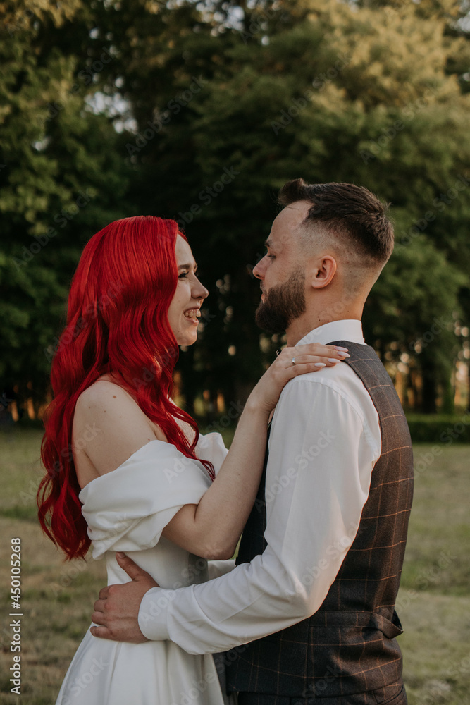 Wedding day. Happy bride and groom hugging and laughing Red hair diversity