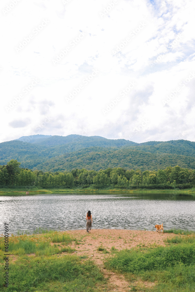 Back view traveler woman looking at uncontaminated nature Traveler Teen Tourist Visiting Trip Vacation Concept Back view traveler woman looking at uncontaminated nature Traveler Teen Tourist Visiting Trip Vacation Concept