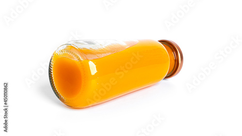 Orange juice in bottle isolated on a white background.