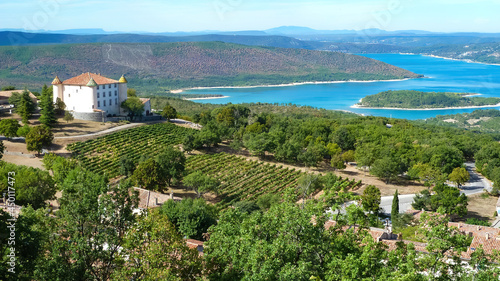 View over vineyard into valley with blue beautiful lake in summer - Lac de sainte croix, France photo