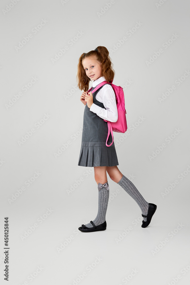 adorable schoolgirl with backpack. Back to school