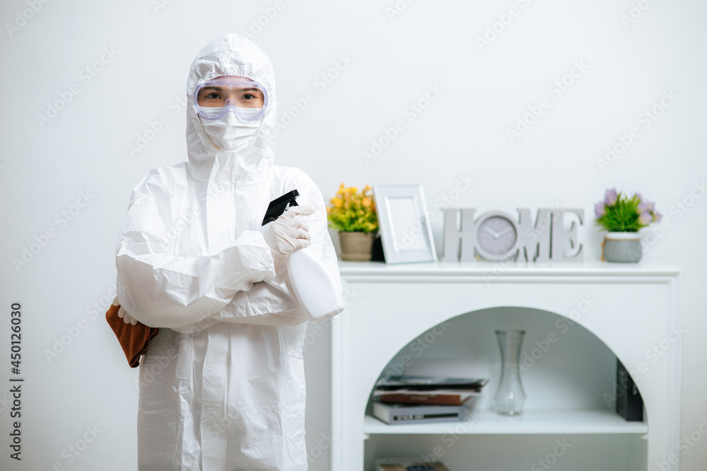 Fototapeta premium Disinfection specialist in PPE suit performing public decontamination