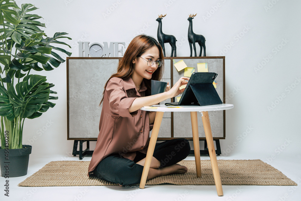 Fototapeta premium Young pretty woman relax with coffee while work from home