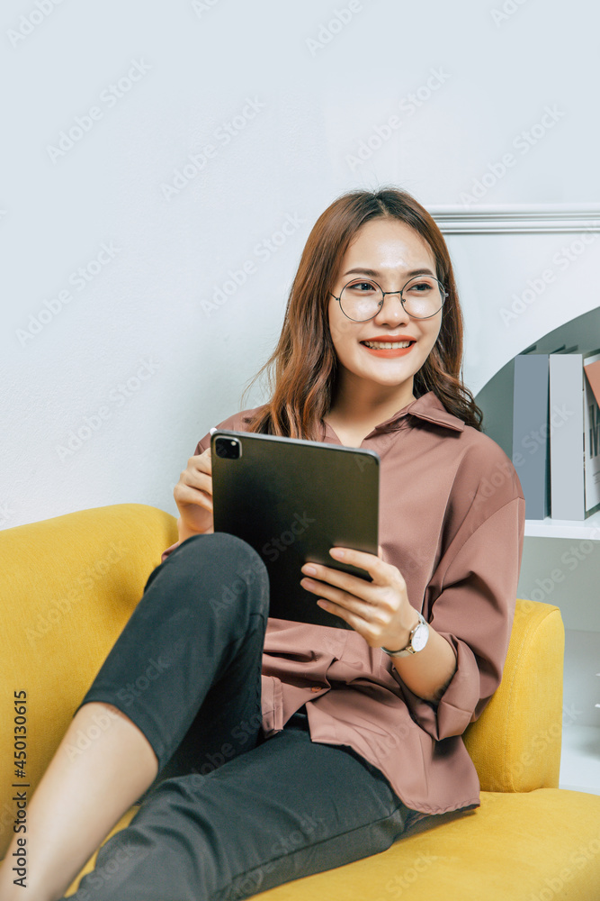Young woman working from home with digital tablet and pen Young woman working from home with digital tablet and pen