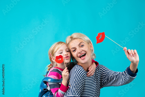 Happy loving family. mother and child girl playing, kissing and hugging. Family time. Family with health teeth. Family dentist. Mom with daughter smiling together. photo
