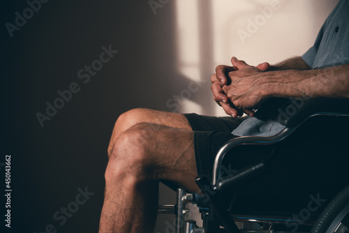 Lonely disabled man on wheelchair in the house, Depression occurs in people with disabilities who are alone at home.