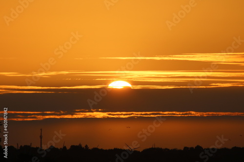 Sunset behind clouds in Timmendorf Beach, Germany