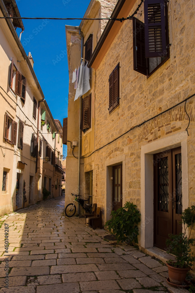A quiet back street in the historic medieval coastal town of Porec in Istria, Croatia
