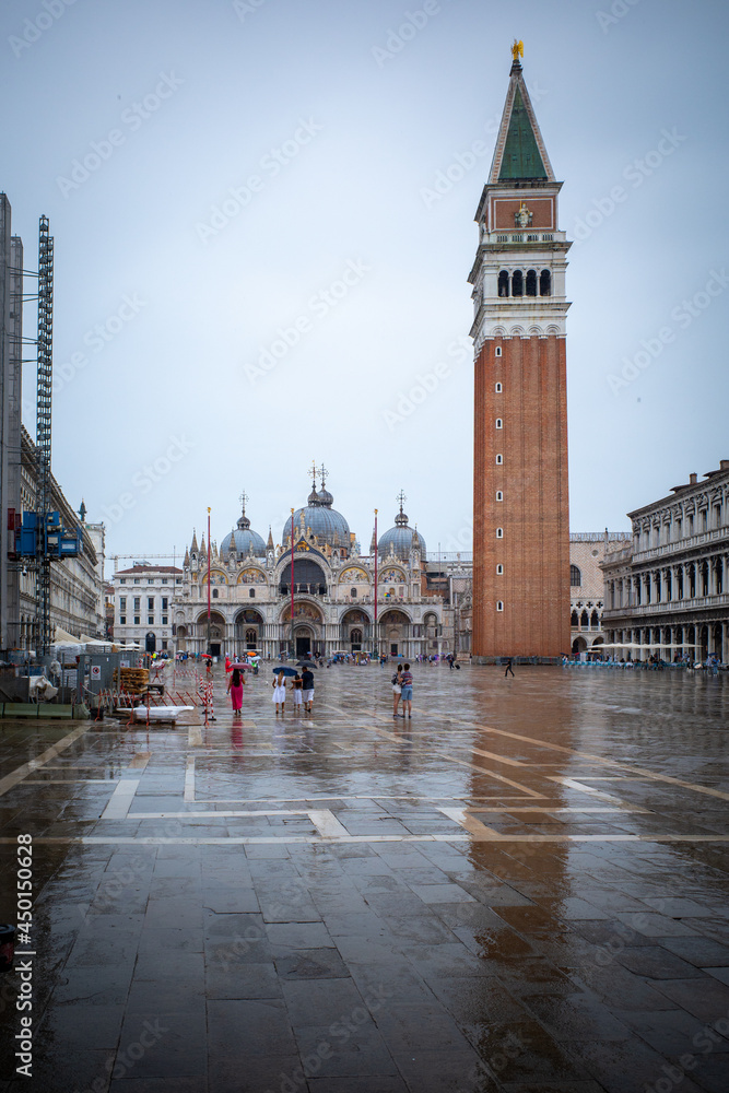 Venice's marcus square in rain is almost deserted