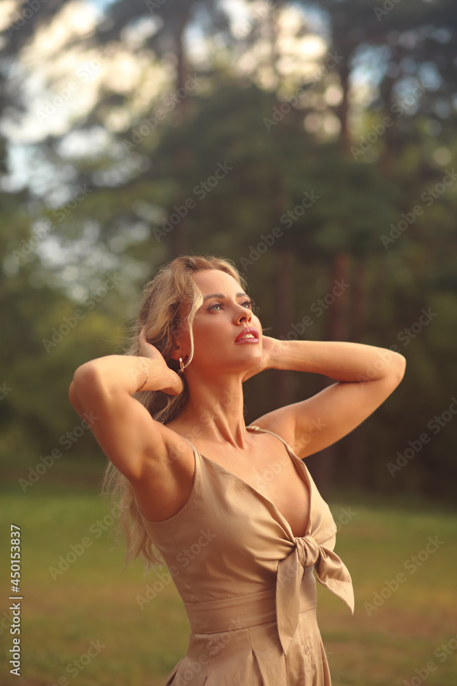Beautiful dreaming woman looking up on the sky outdoors summer.green trees background with depilation armpits . Closeup Beautiful dreaming woman looking up on the sky outdoors summer.green trees background with depilation armpits . Closeup