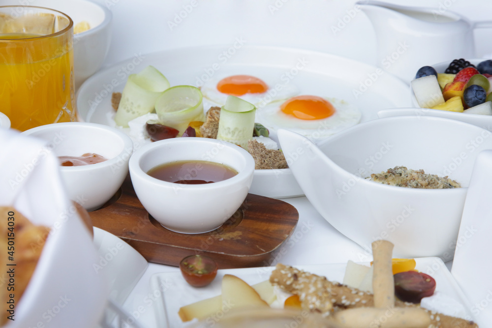 Breakfast in luxutry hotel with orange juice and various delicious choices of food. Breakfast in luxutry hotel with orange juice and various delicious choices of food.