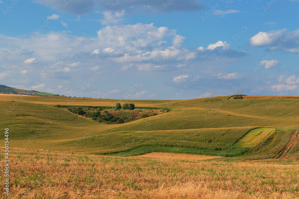 Beautiful wavy landscape of Moravian Tuscany in the Czech Republic. Blue sky and clouds.