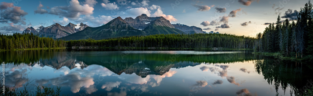 PANORAMA OF MOUNTAINS AND CLOUDS REFLECTION OFF THE SURFACE OF HERBERT LAKE- - BANFF NP