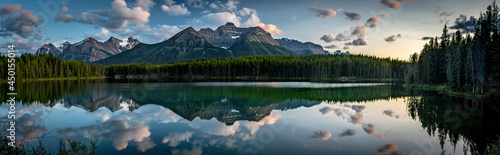 PANORAMA OF MOUNTAINS AND CLOUDS REFLECTION OFF THE SURFACE OF HERBERT LAKE- - BANFF NP © darcy