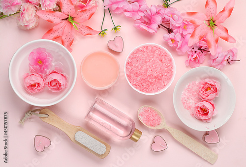 Spa and wellness composition with aromatic rose water, salt, roses, archidea flowers and sakura, aromatherapy and skin care, lifestyle concept, invitation and advertising,