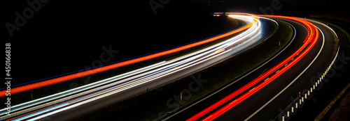 Night road lights. Lights of moving cars at night. long exposure red, blue, green