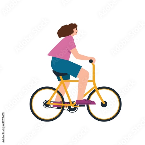 Young woman on bycicle. Smiling happy girl rides bike.