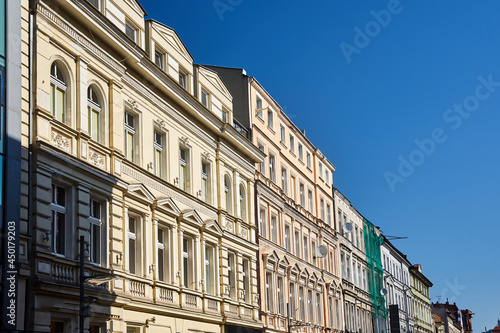 street with facades of historic tenement houses