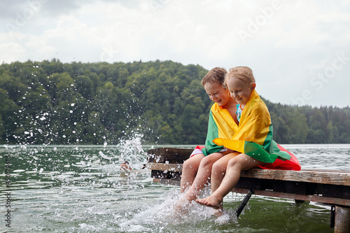 spending summer time with kids on lithuanian lakes photo