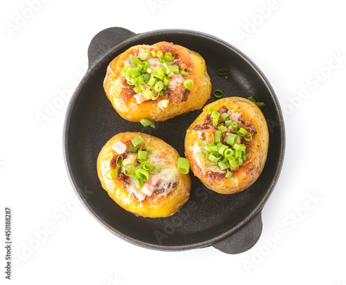 Frying pan with baked potato on white background