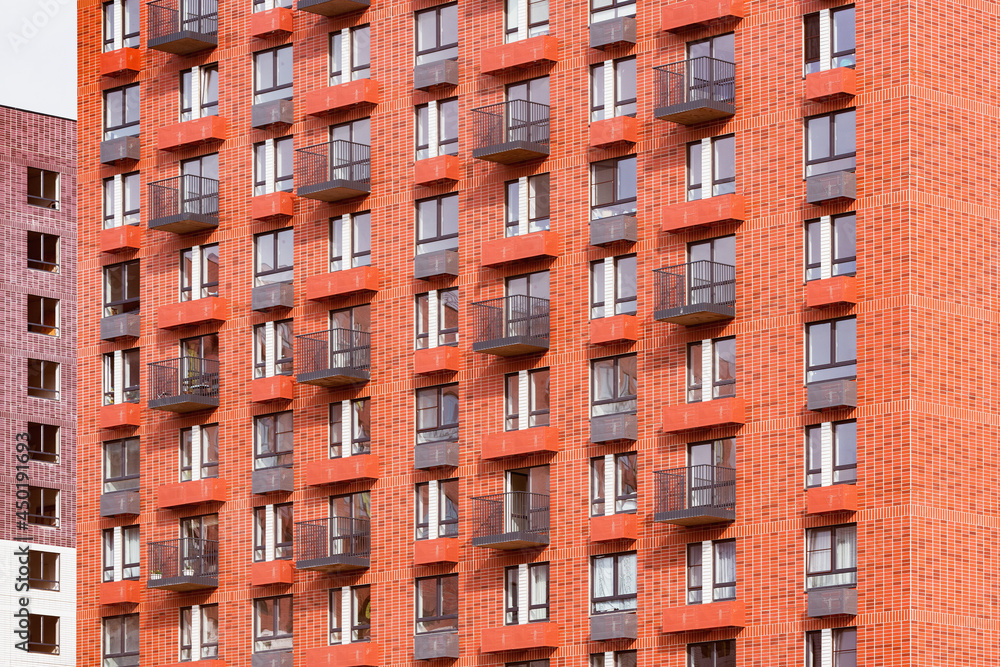 Exterior of the red new apartment building after construction. Exterior of the red new apartment building after construction.