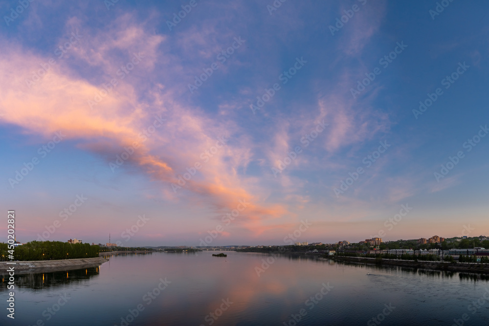 Evening view of Irkutsk from Glazkovsky bridge across the Angara