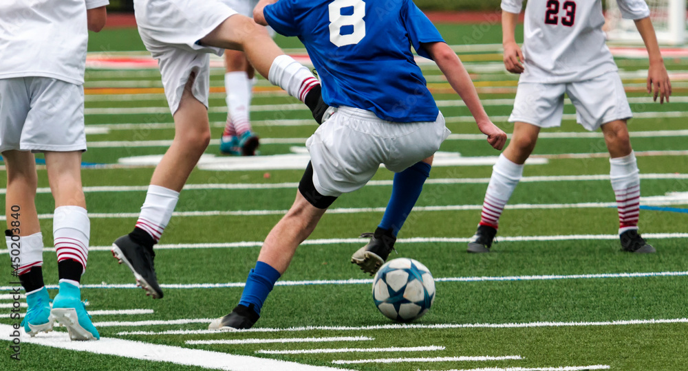 A High School Soccer Player Is Out Numbered By His Competition Making A a-high-school-soccer-player-is-out-numbered-by-his-competition-making-a