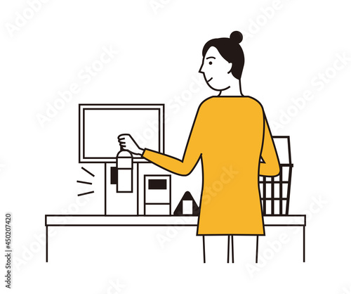 コンビニのセルフレジで商品をスキャンする女性