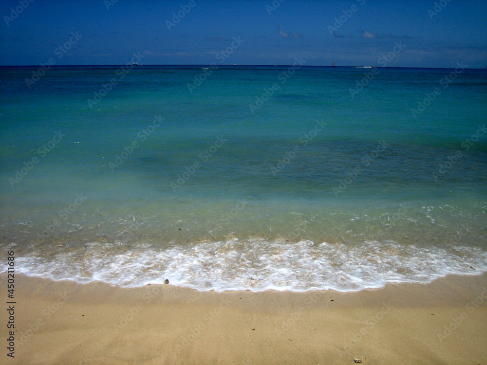 Beautiful Blue Calm Lapping Ocean on Golden Sand