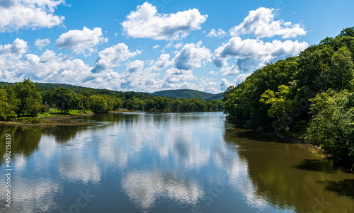 Clouds reflecting up on the Allegheny river in Tidioute  Pennsylvania  USA on a sunny summer day