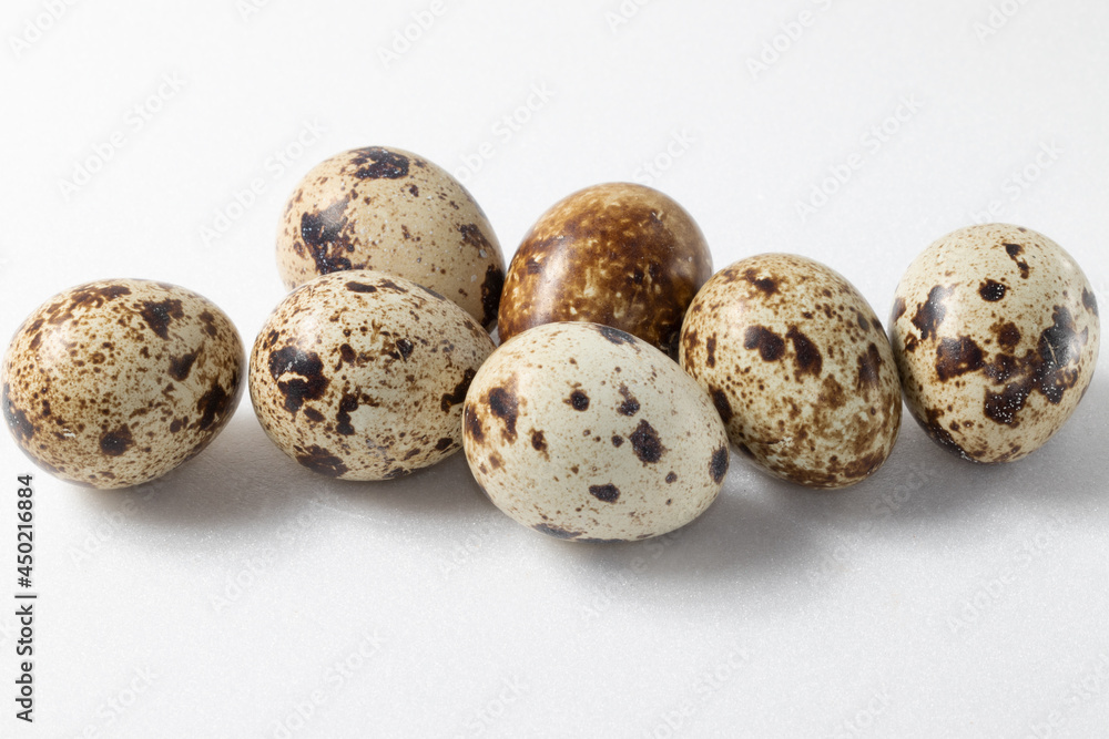 Quail eggs close up on white background. Quail eggs close up on white background.