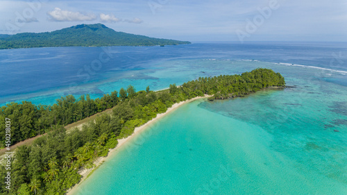 Aerial view of a tropical island with an airstrip in the Solomon Islands.