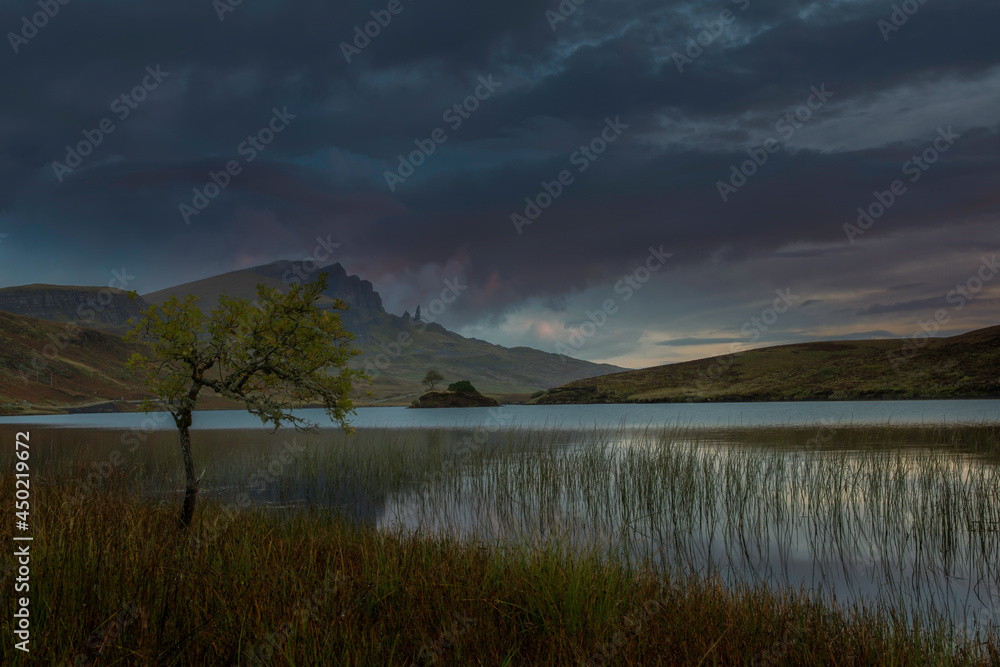 Loch Fada with the Old man of storr at sunrise, located on the Isle of Skye, Scotland.