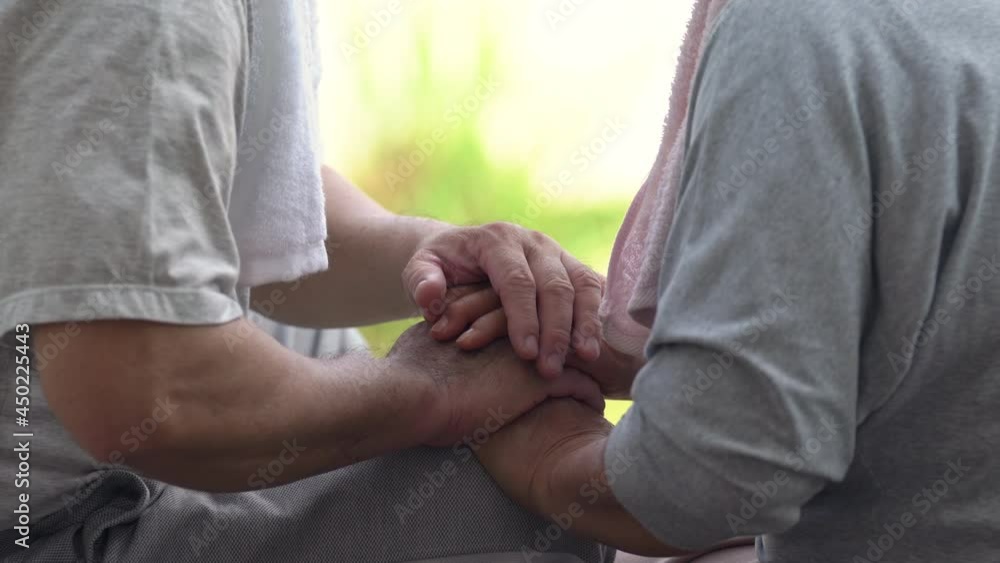 4K Asian senior couple holding hands together. Happy Asian family elderly husband and wife do workout exercise together in the morning. Retirement older man and woman enjoy leisure activity at home 4K Asian senior couple holding hands together. Happy Asian family elderly husband and wife do workout exercise together in the morning. Retirement older man and woman enjoy leisure activity at home