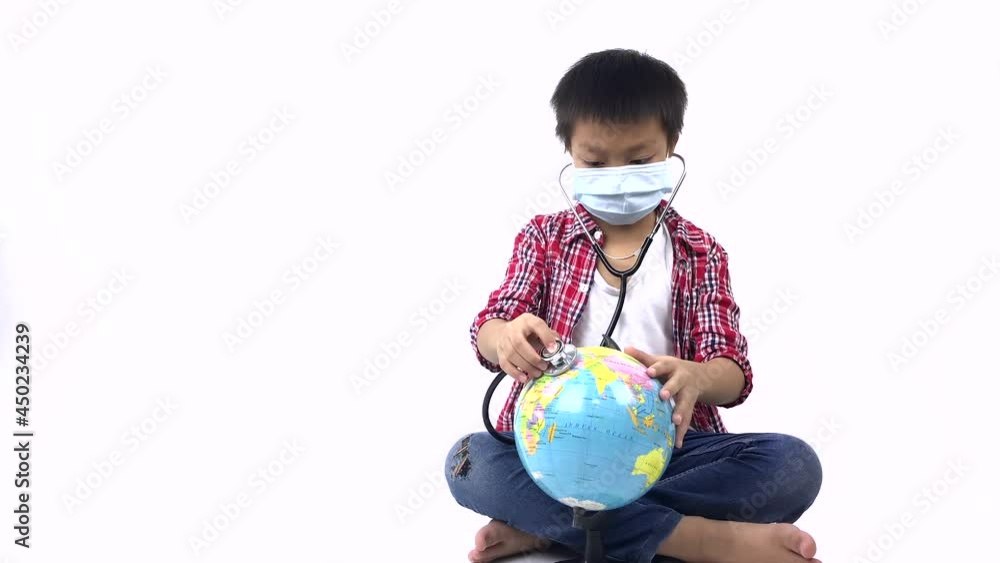 Mask Boy5. Save the wold and Earth healthcare concept. A good looking asian boy in a self-protect mask using a stethoscope with on the world globe on white background. Mask Boy5. Save the wold and Earth healthcare concept. A good looking asian boy in a self-protect mask using a stethoscope with on the world globe on white background.