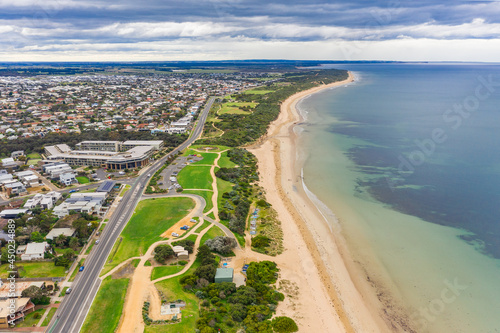 Wallpaper Mural Aerial view looking along a a coastal reserve alongside a beach and city esplanade Torontodigital.ca