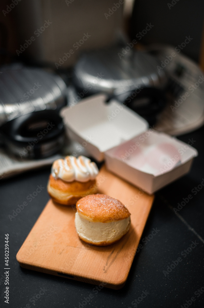 homemade flavored doughnuts on wooden board homemade flavored doughnuts on wooden board