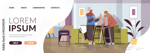 friendly nurse or volunteer supporting arab elderly man with walkers home care services healthcare