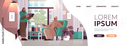 friendly nurse or volunteer bringing food to arab elderly woman home care services healthcare and social support