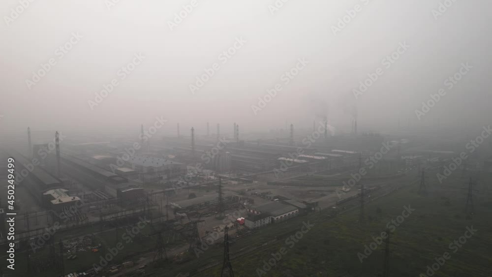 View of the aluminum plant, heavy smoke, environmental pollution, toxic smoke, very poor visibility View of the aluminum plant, heavy smoke, environmental pollution, toxic smoke, very poor visibility