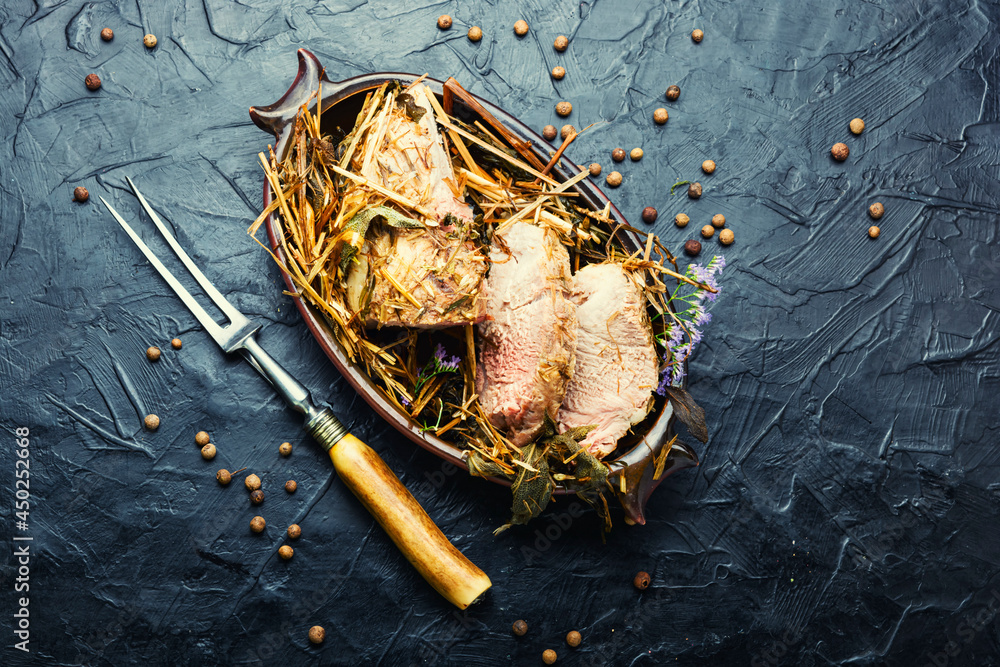 Naklejka premium Baked meat with spicy herbs,space for text