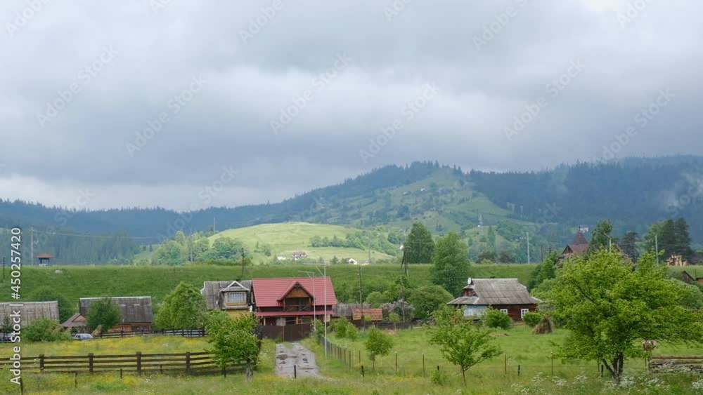 Evening landscape in the mountains. Alpine village view from the mountain. Summer mountain landscape in the Carpathians. Evening landscape in the mountains. Alpine village view from the mountain. Summer mountain landscape in the Carpathians.