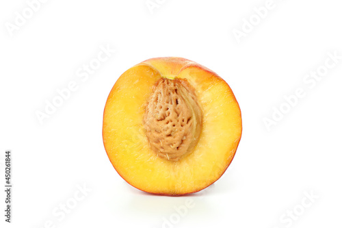 Half of peach fruit isolated on white background