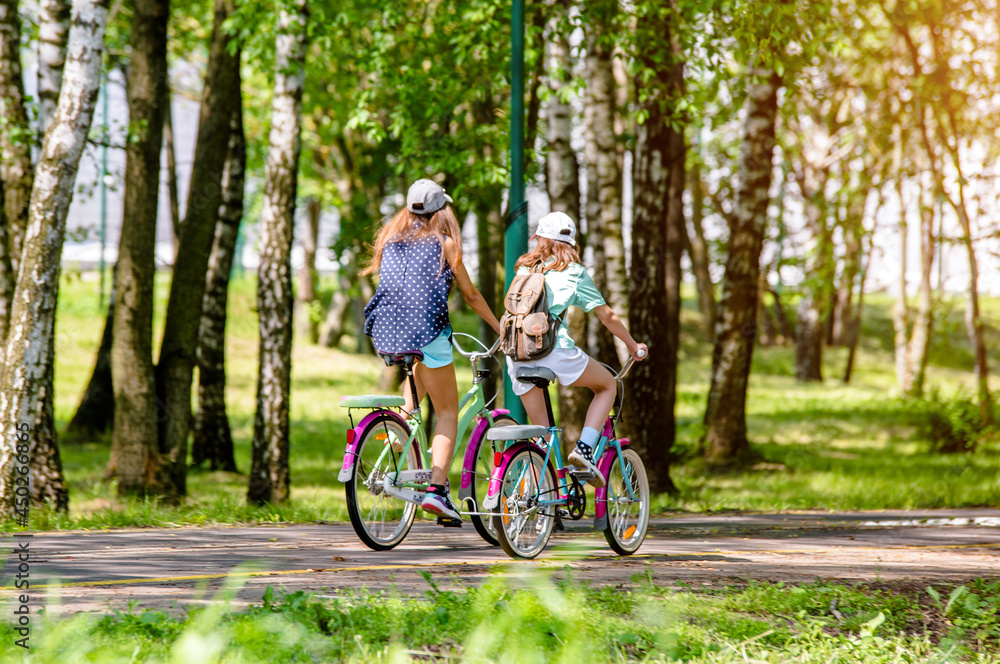 Cyclists ride on the bike path in the city Park
