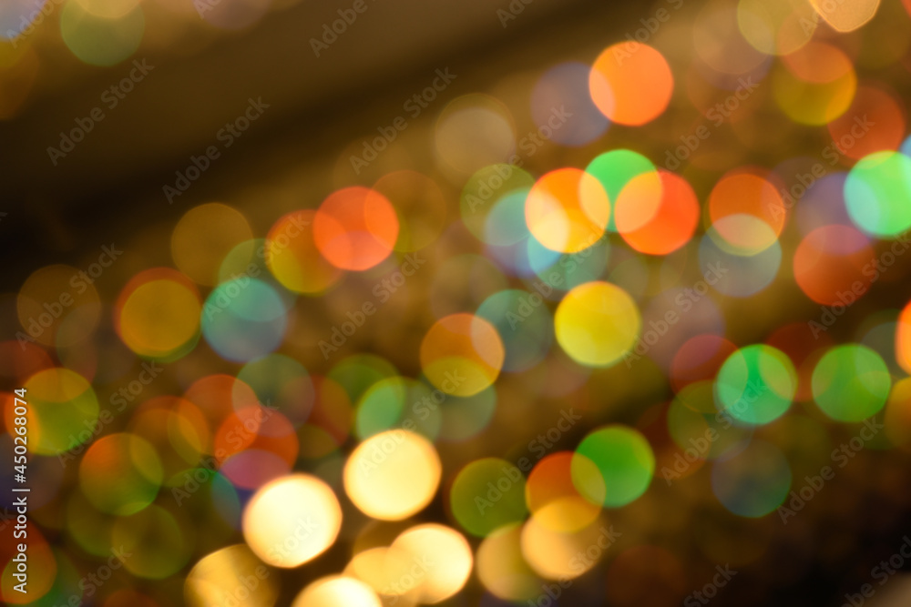 Abstract colorful glowing rainbow drops and sparkles on dark background. Rainbow bokeh in lines overlay. Abstract colorful glowing rainbow drops and sparkles on dark background. Rainbow bokeh in lines overlay.