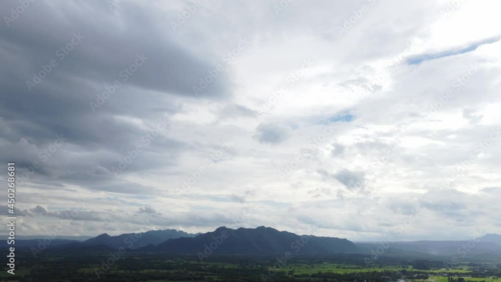 Move Camera Aerial drone shot panoramic view, Forest many trees fresh green, mountain peaks spectacular on sky background. Move Camera Aerial drone shot panoramic view, Forest many trees fresh green, mountain peaks spectacular on sky background.